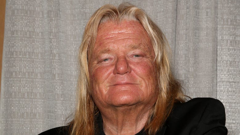 Greg "The Hammer" Valentine posing for a photo