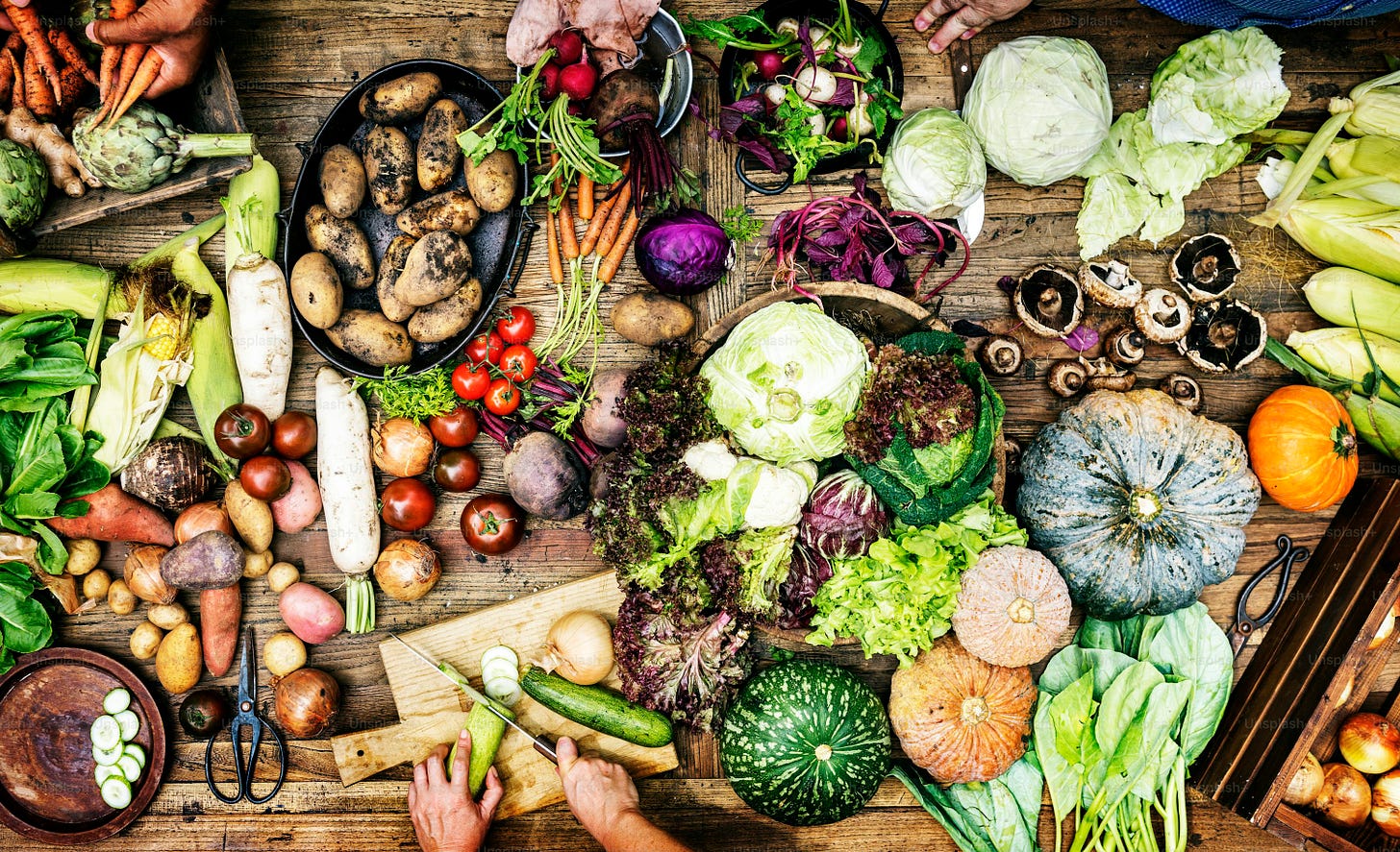 Aerial view of fresh organic various vegetable on wooden table