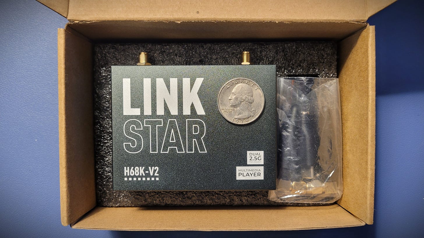LinkStar H68K unboxing, quarter shown for scale