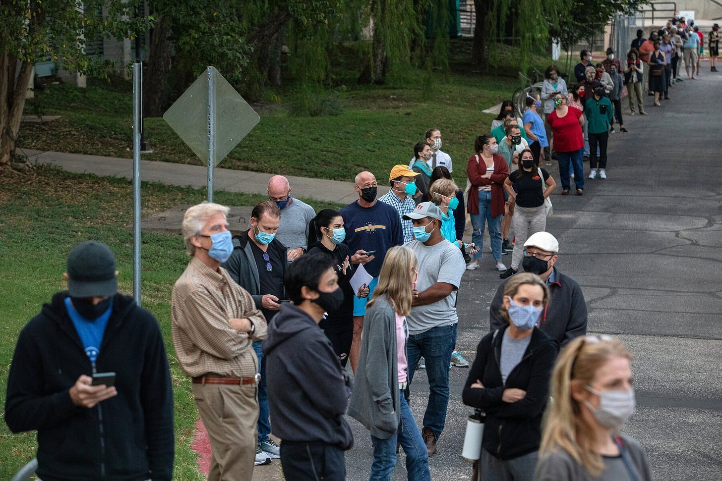 A group of people wearing face masks

Description automatically generated