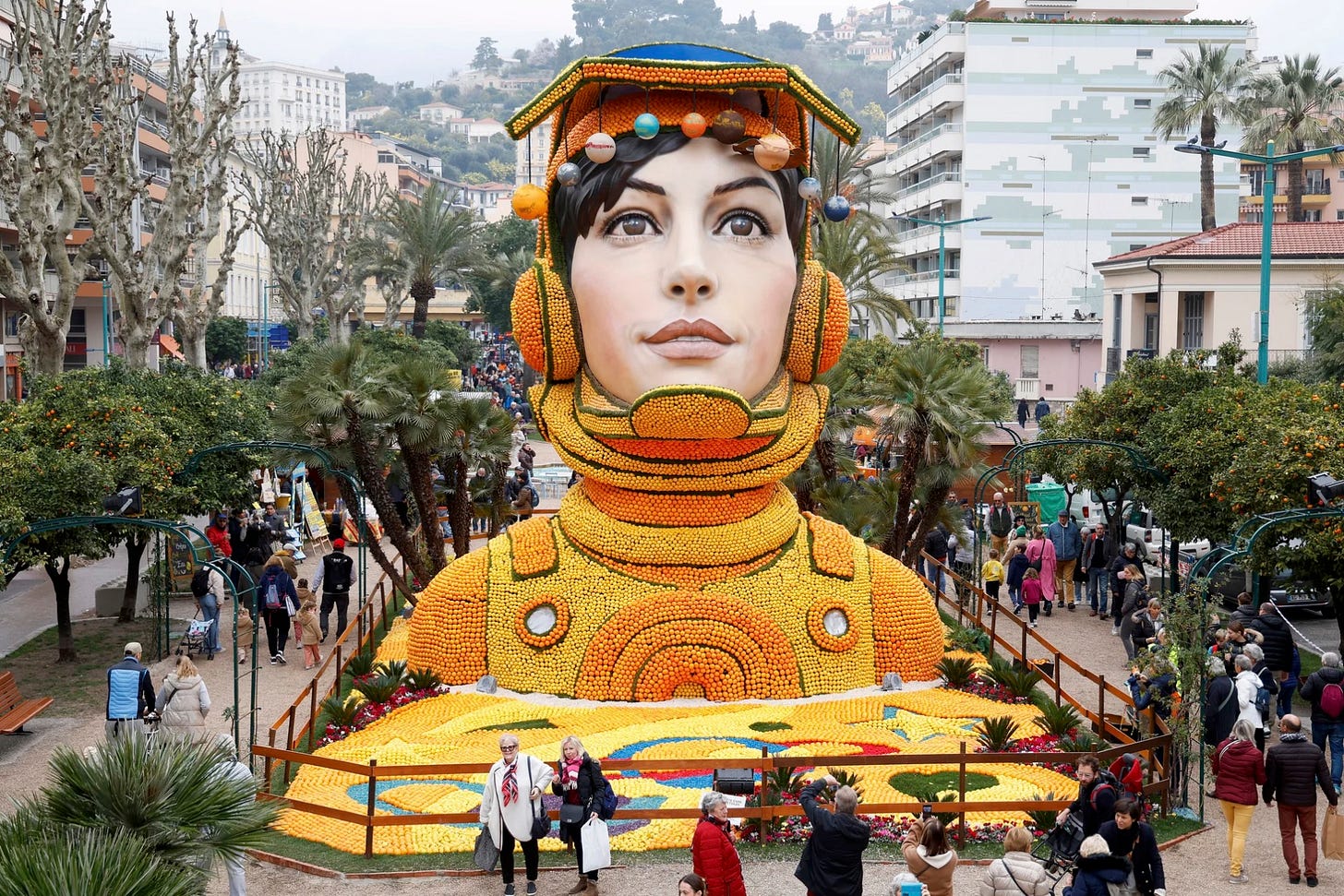 Menton, France. Visitors look at a sculpture made with oranges and lemons, at the 91st lemon festival. This year’s theme is journey to the stars. Sébastien Nogier/EPA