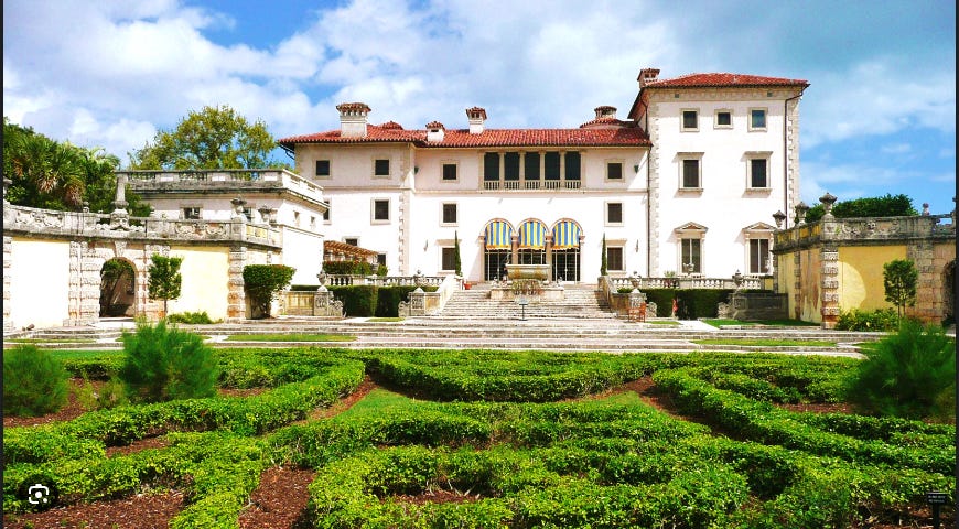 Villa Vizcaya from the back showing its facade and garden. 