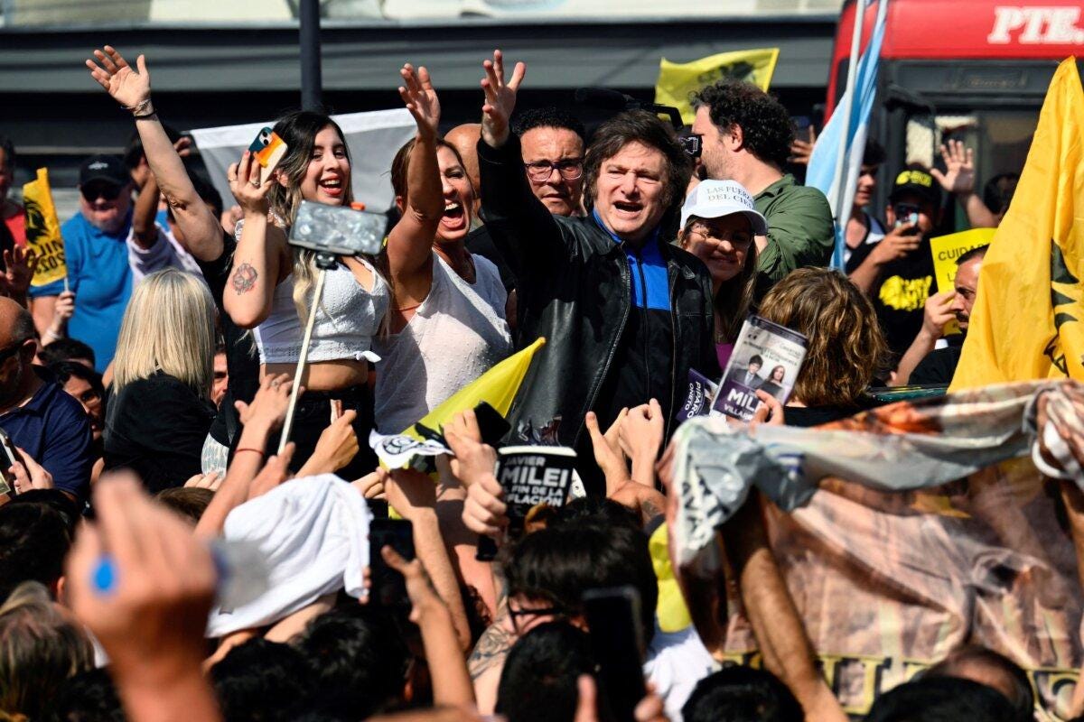  Argentine congressman and presidential candidate for La Libertad Avanza Javier Milei (C) greets supporters during a campaign rally in Lomas de Zamora, Buenos Aires province, Argentina, on Oct. 16, 2023. (Luis Robayo/AFP via Getty Images)