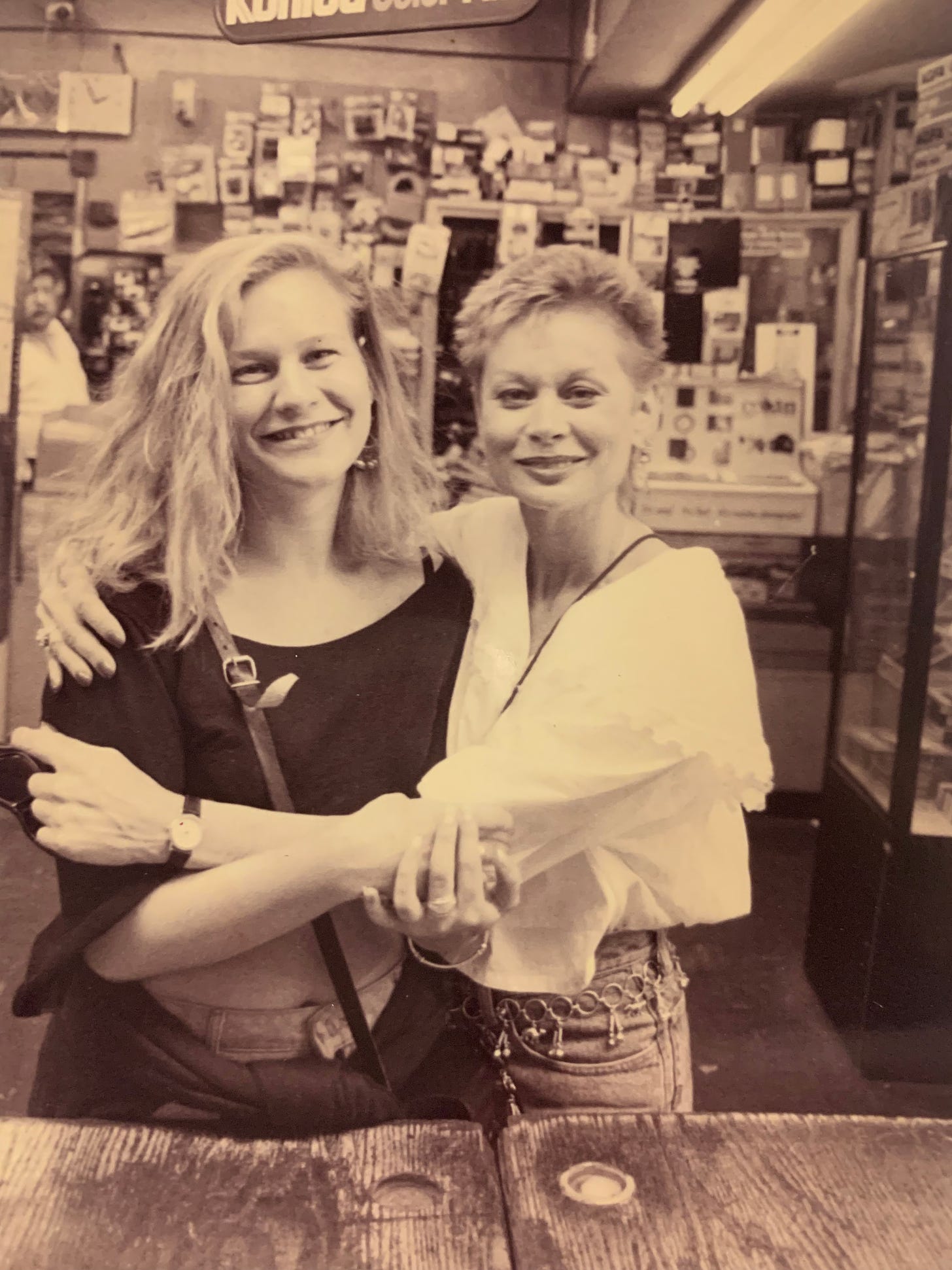 two women smiling in new york city in a store