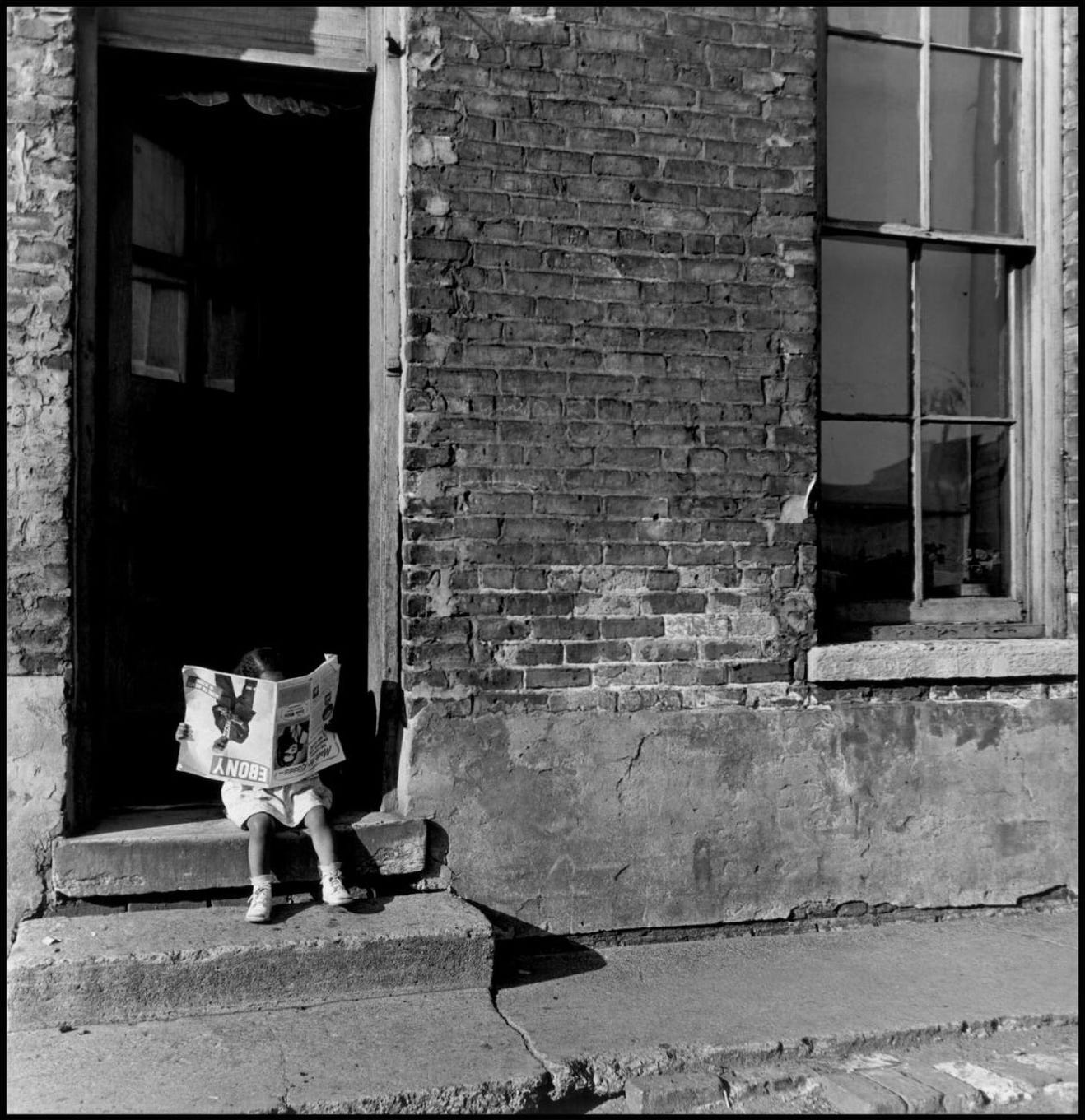 Girl reading Ebony magazine. Chicago, Illinois, 1947. © Wayne Miller