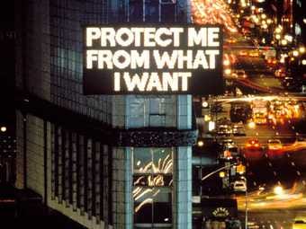 Electronic billboard over busy streets with words Protect Me From What I Want