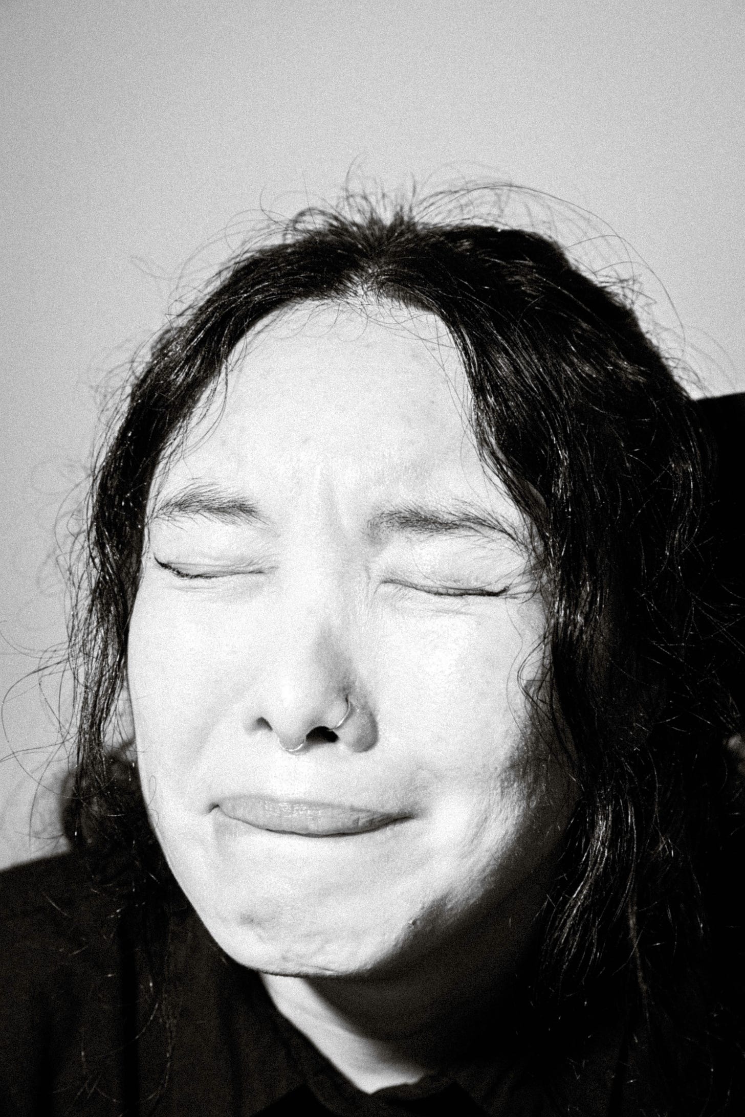 Woman with black hair crying