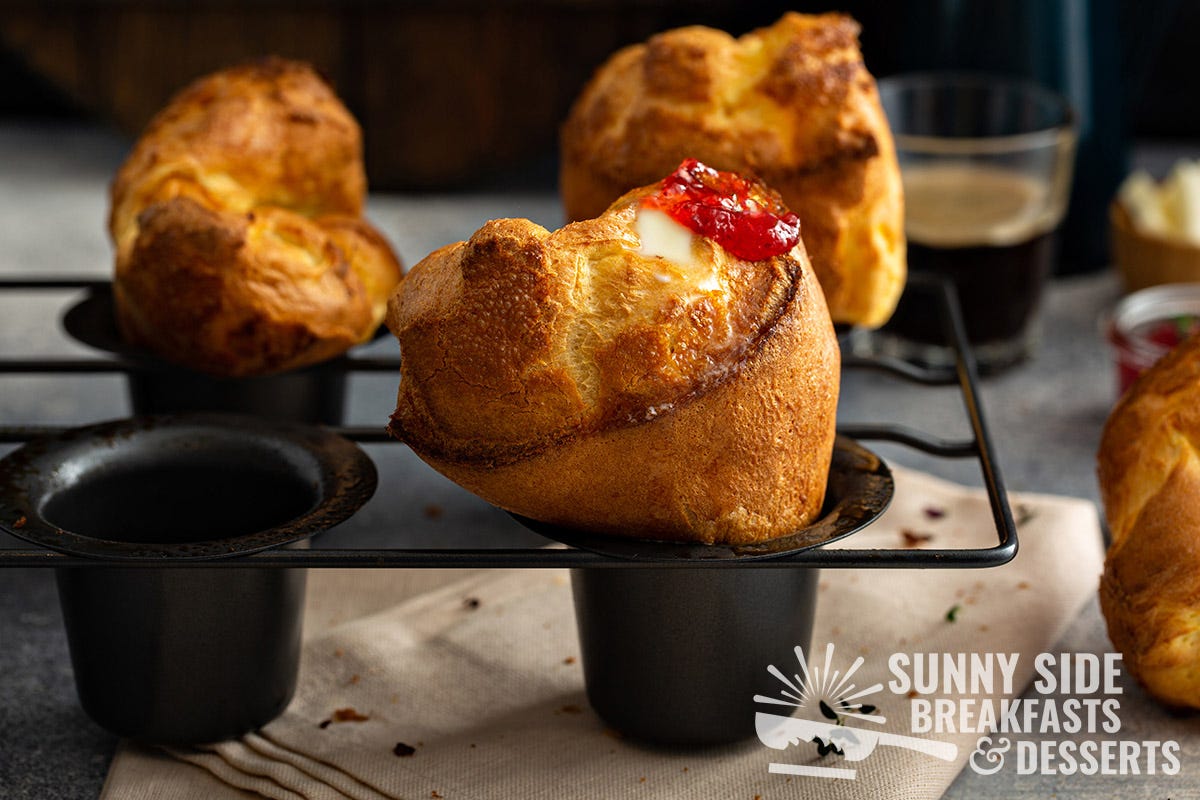 Golden popovers in a pan.