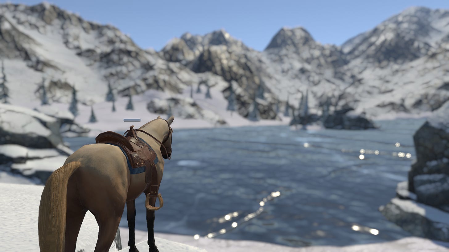 A light brown horse with a saddle faces a frozen lake in a snowy mountainous landscape.