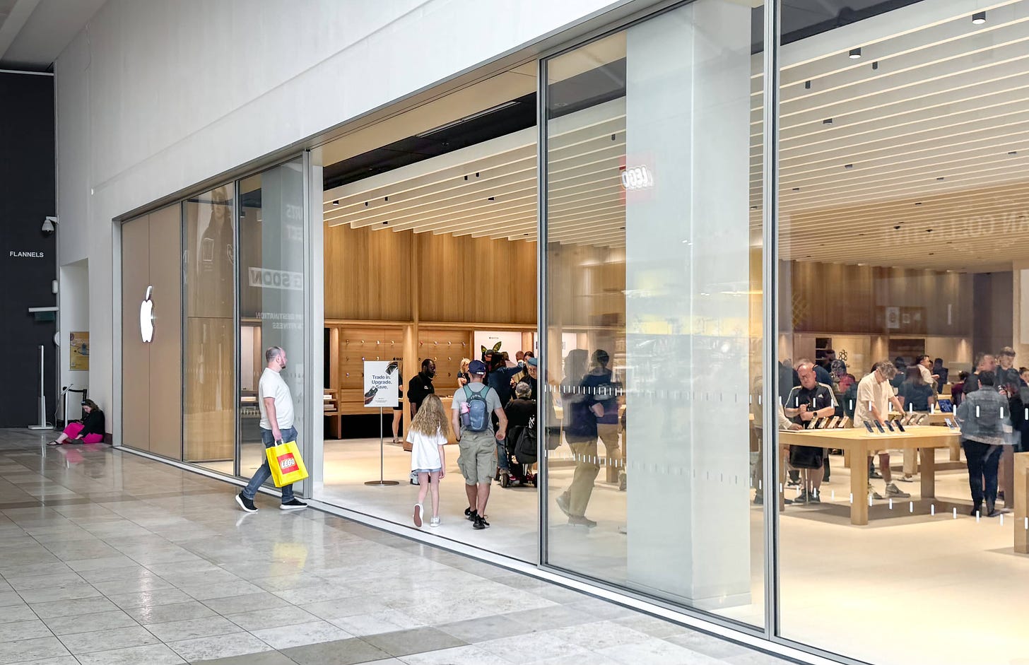 The entrance to Apple Milton Keynes. Customers enter through the sliding glass doors.