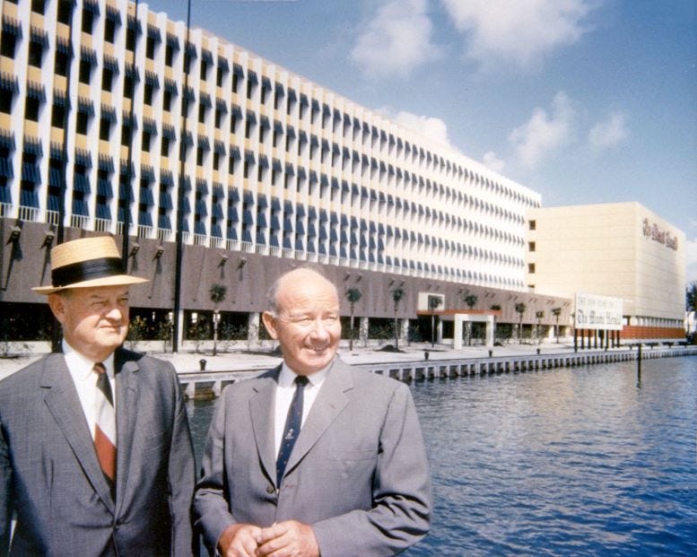 John and James Knight standing behind the Miami Herald building in March of 1963.