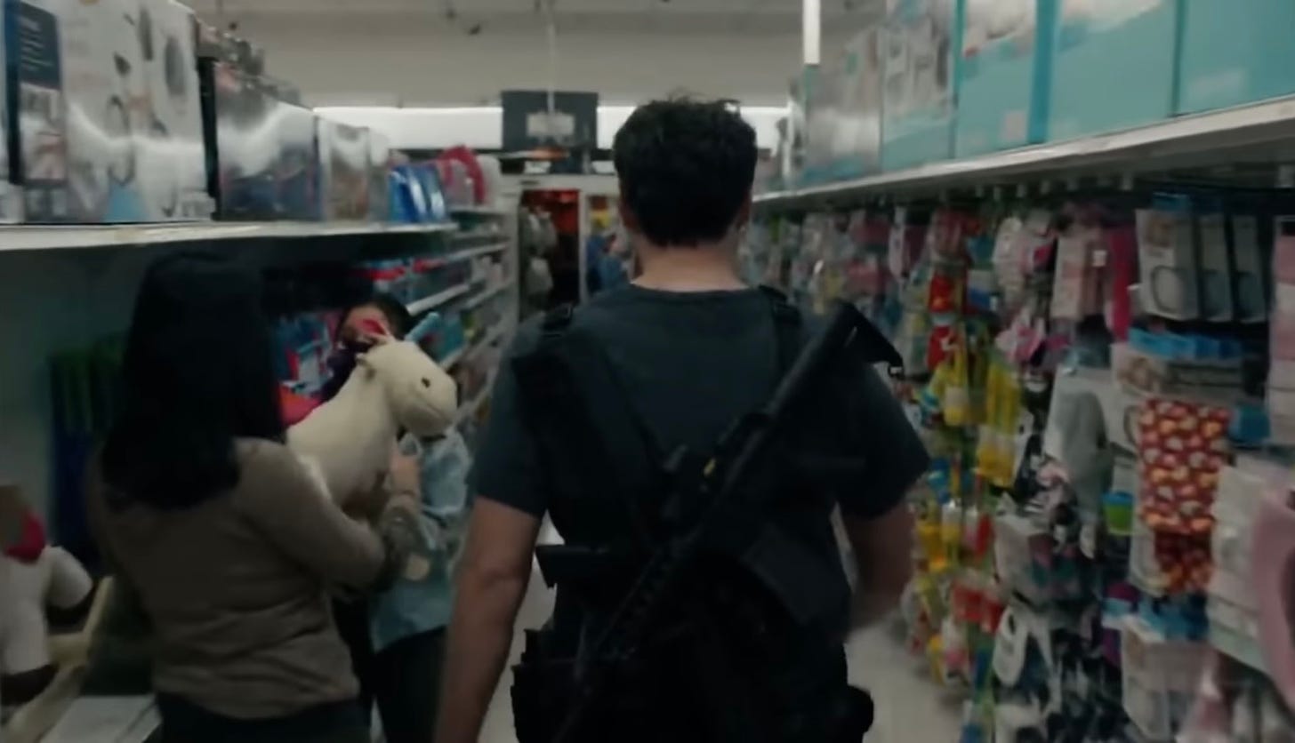 Bill Hader as Barry Berkman, fully strapped with weapons, strolling through a toy aisle in Barry