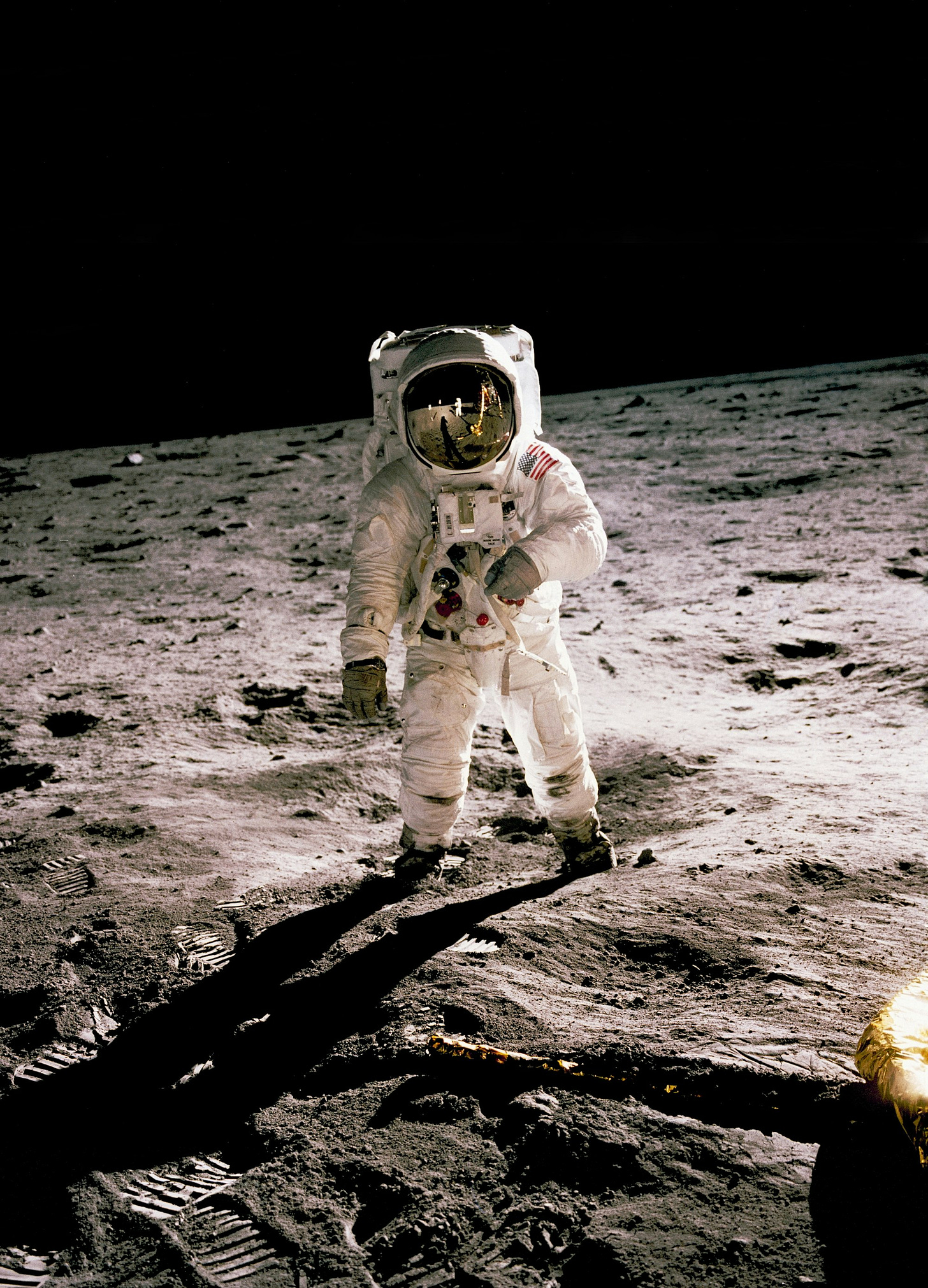 astronaut standing on the moon