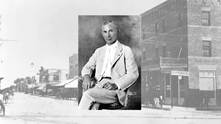 Isidor Cohen with a background of Flagler Street in the early 1900s.