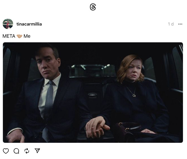 A screenshot of a post on Threads by @tinacarmillia. The caption is, "META 🤝🏼 Me," and the image attached is a screenshot from the TV series Succession, showing Tom and Shiv holding hands at the back of a car while looking very much not in love with each other.