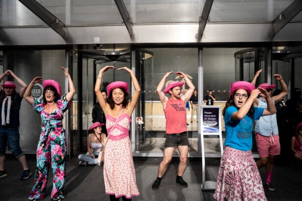 Protesters dance in front of Citi on Aug. 20.