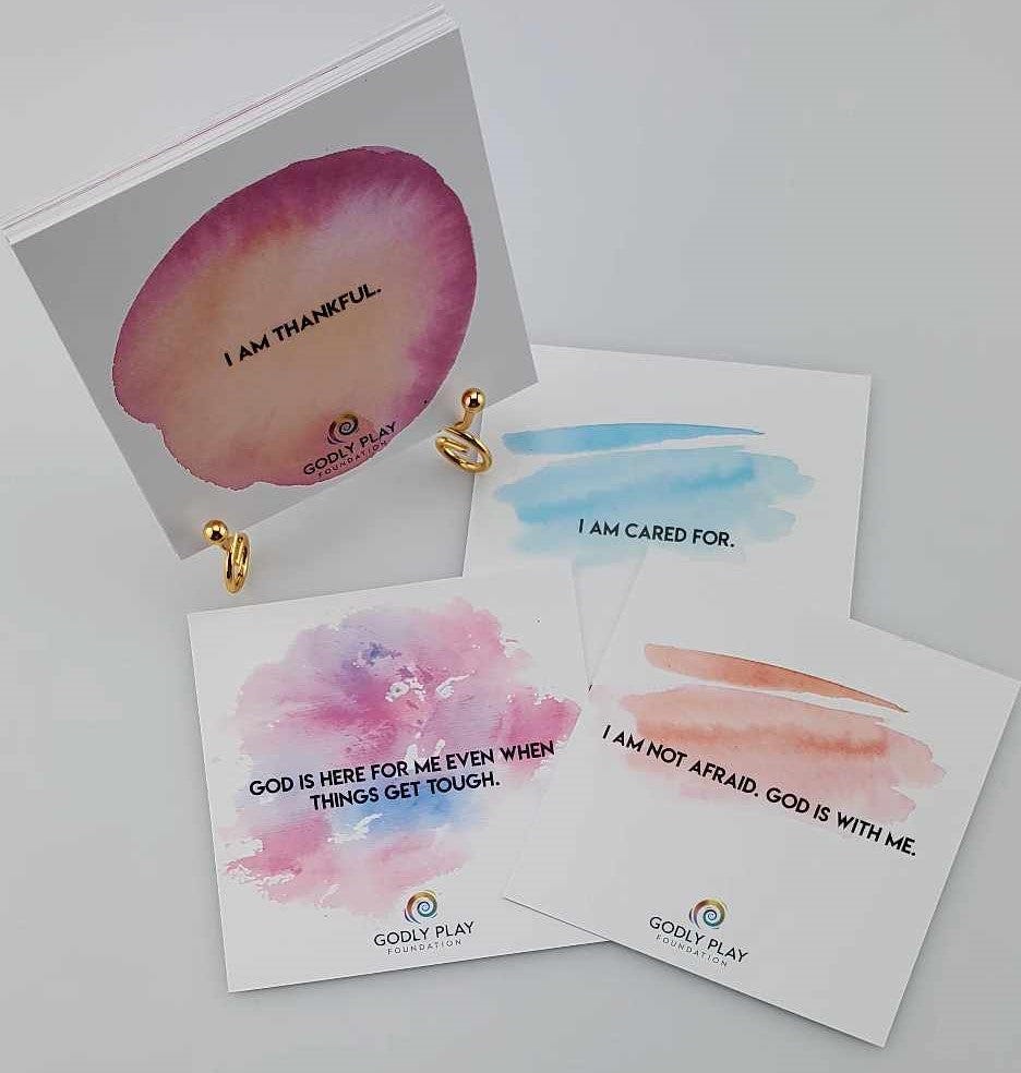 The Godly Play affirmation cards showing text like "I am thankful" and "I am cared for."