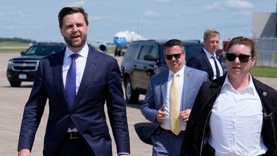 Republican vice presidential nominee Sen. JD Vance, R-Ohio, right, walks back from looking at Air Force Two, Vice President Kamala Harris' plane, at Chippewa Valley Regional Airport, Wednesday, Aug. 7, 2024, in Eau Claire, Wis. (AP Photo/Alex Brandon)(AP)