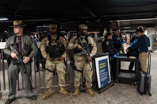 Police and National Guard troops patrol Grand Central Station on Wednesday. (Photo by Adam Gray/Getty Images) Getty Images