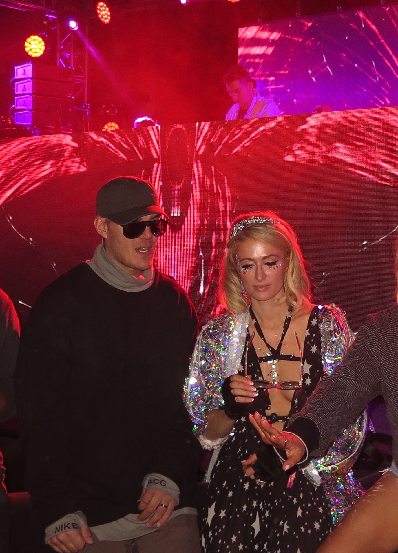 Paris Hilton looked beautiful dancing with her fiancee Chris Zylka to DJ Politik's music behind her on stage.