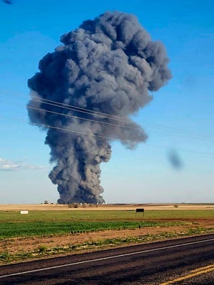 Smoke fills the sky after an explosion and fire at the South Fork Dairy farm near Dimmitt, Texas, on Monday, April 10, 2023. The explosion critically injured one person and killed an estimated 18,000 cows.