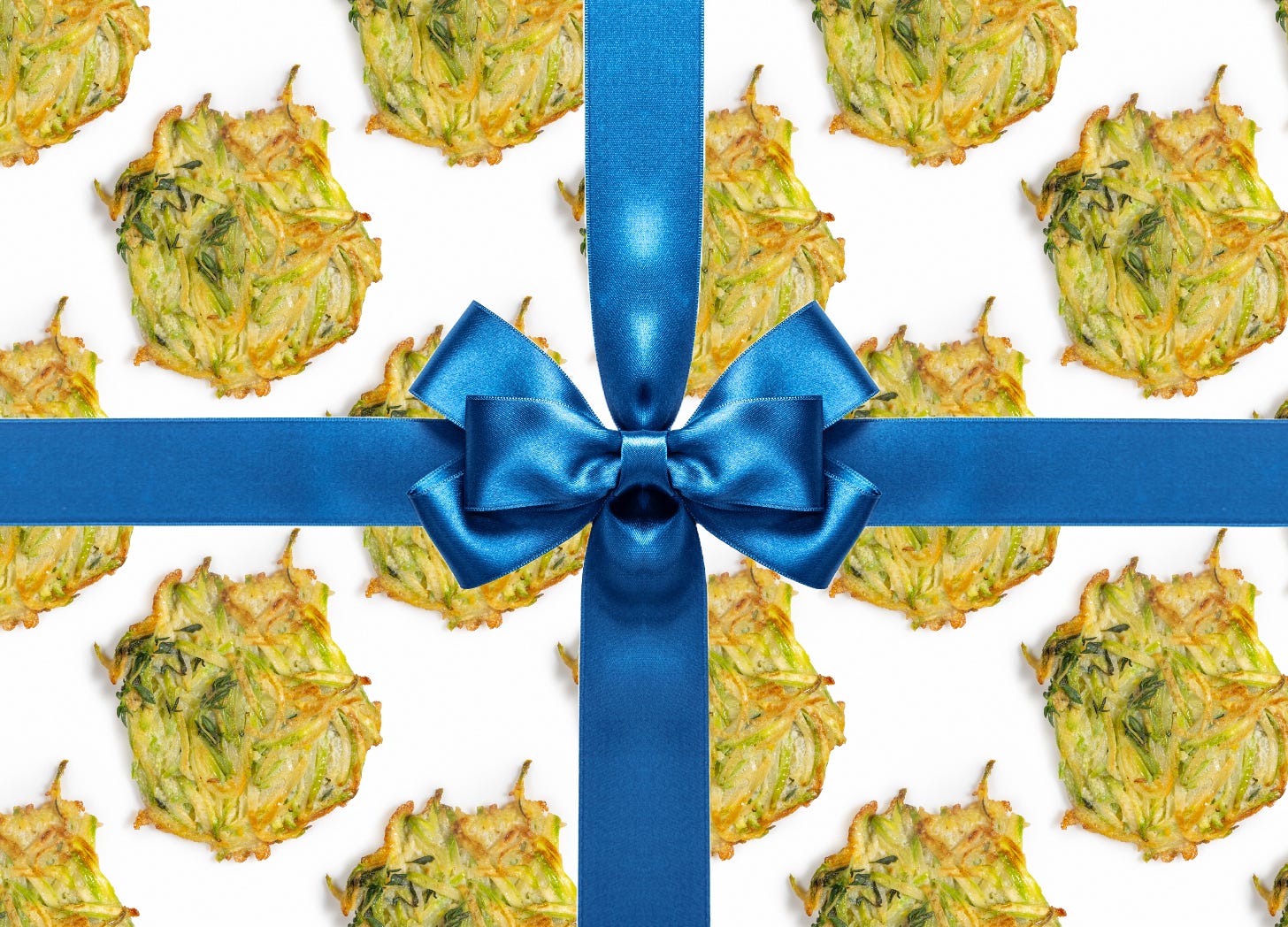a repeating pattern of Hanukkah latkes wrapped by a blue bow, designed by Sam Zee