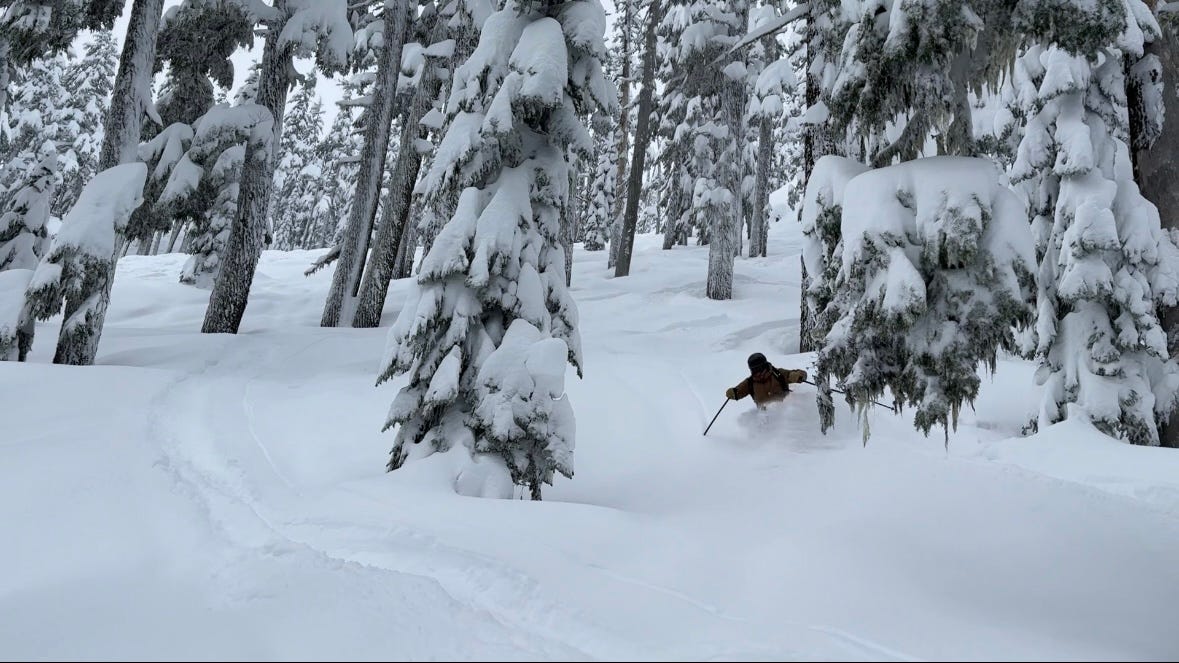 As skier making a turn in deep snow