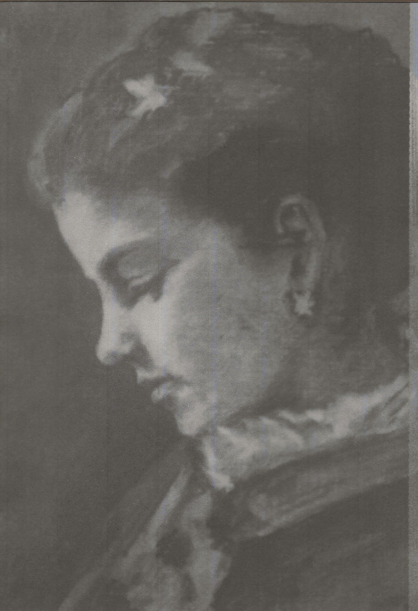 portrait in pencil of teenage girl with upswept hair and star-shaped earrings and hair ornament