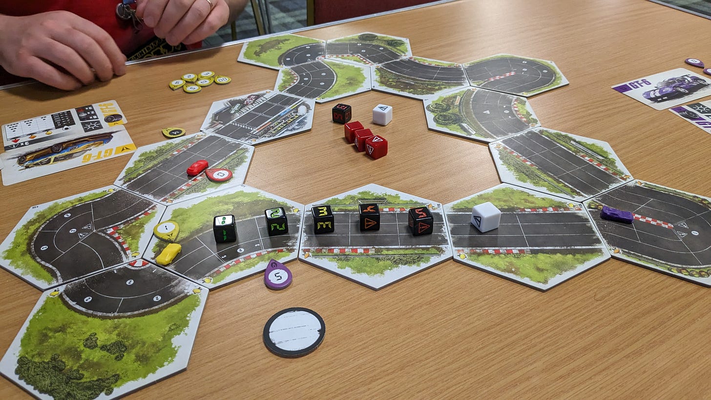 The yellow car pulls out of the corner and accelerates. The yellow car pulls out of the corner and accelerates.