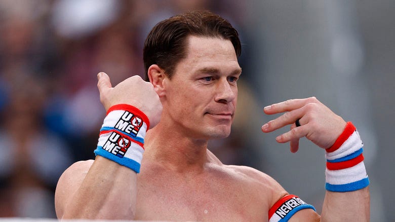 John Cena doing something truly bizarre with his hands