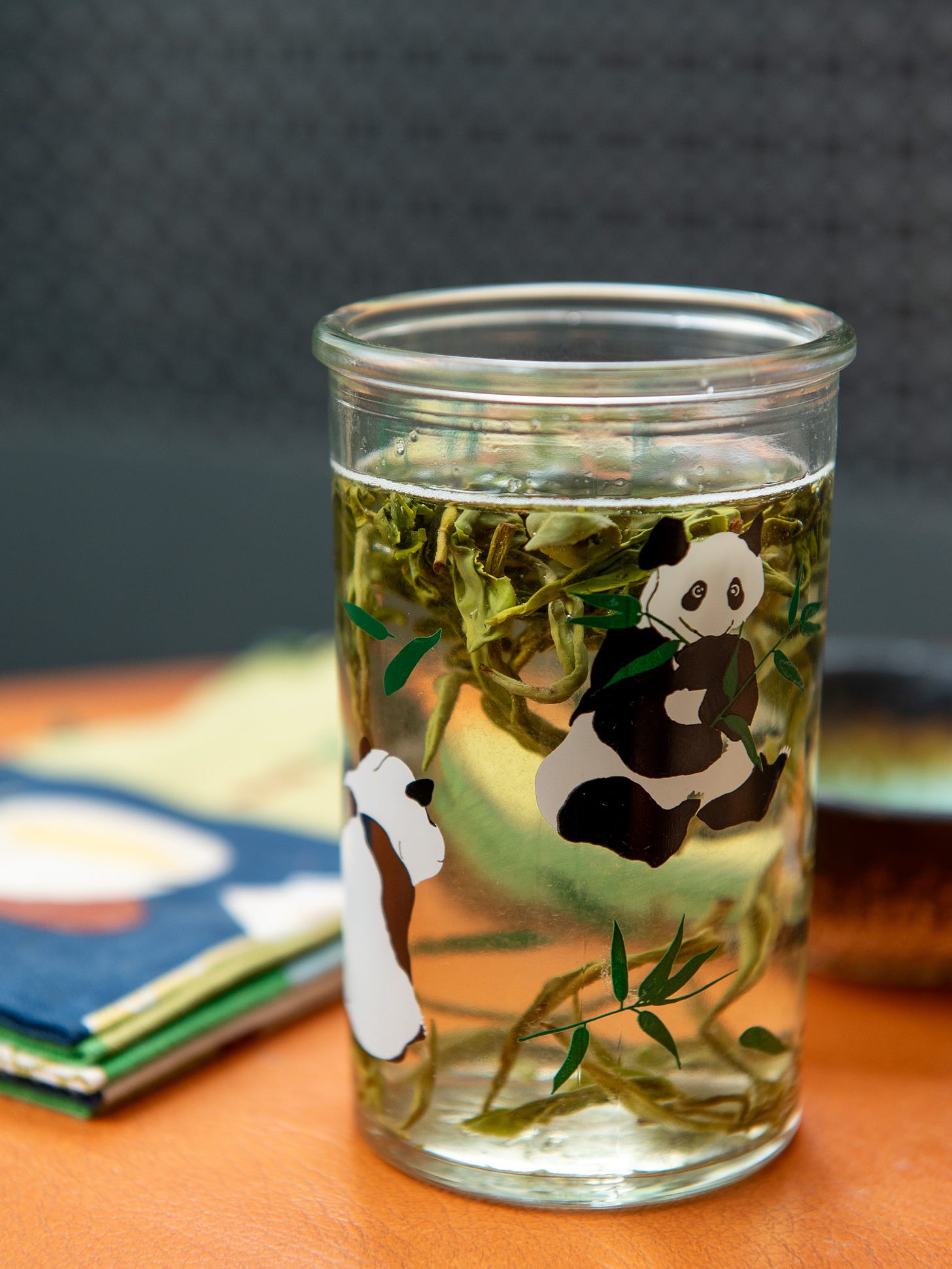 ID: Bi luo chun green tea brewing in a tall glass