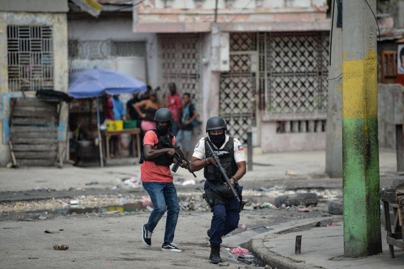 Police officers patrol a neighborhood amid gang-related violence in downtown Port-au-Prince on April 25, 2023.