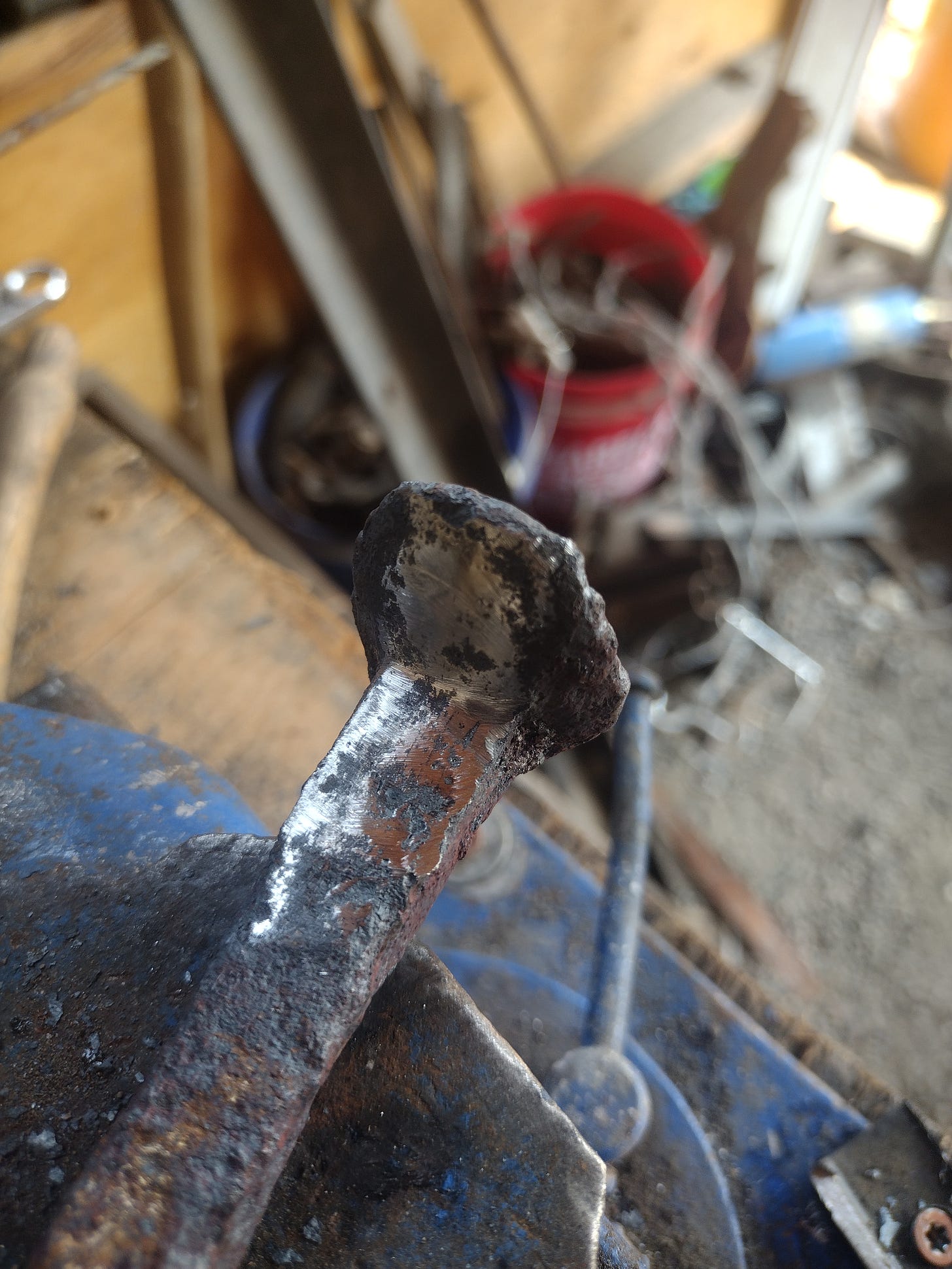 Picture of the railroad spike with the welding surfaces ground flat.