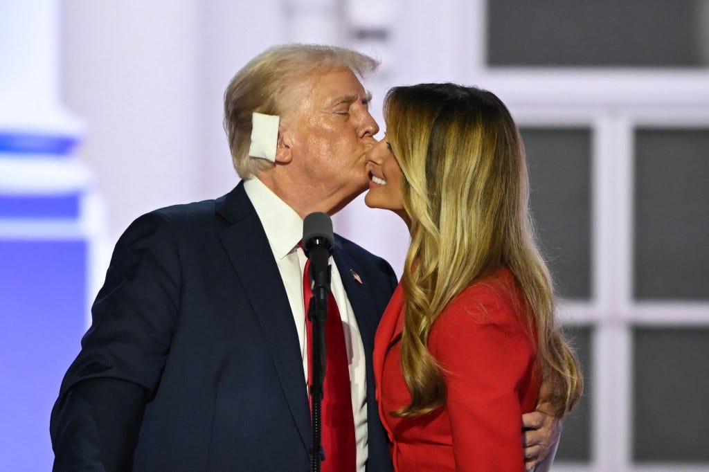 Donald Trump kisses former US First Lady Melania Trump onstage after he accepted his party's nomination on the last day of the 2024 Republican National Convention at the Fiserv Forum in Milwaukee, Wisconsin.