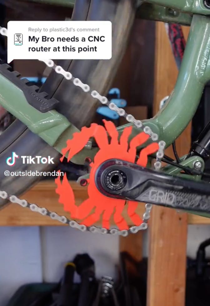 Tiktok frame of a crab-shaped bike chainring, with an embedded comment that reads “My Bro needs a CNC router at this point”