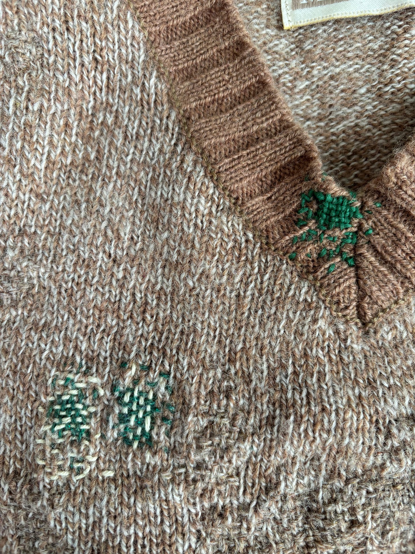 Close up of darning on a sweater