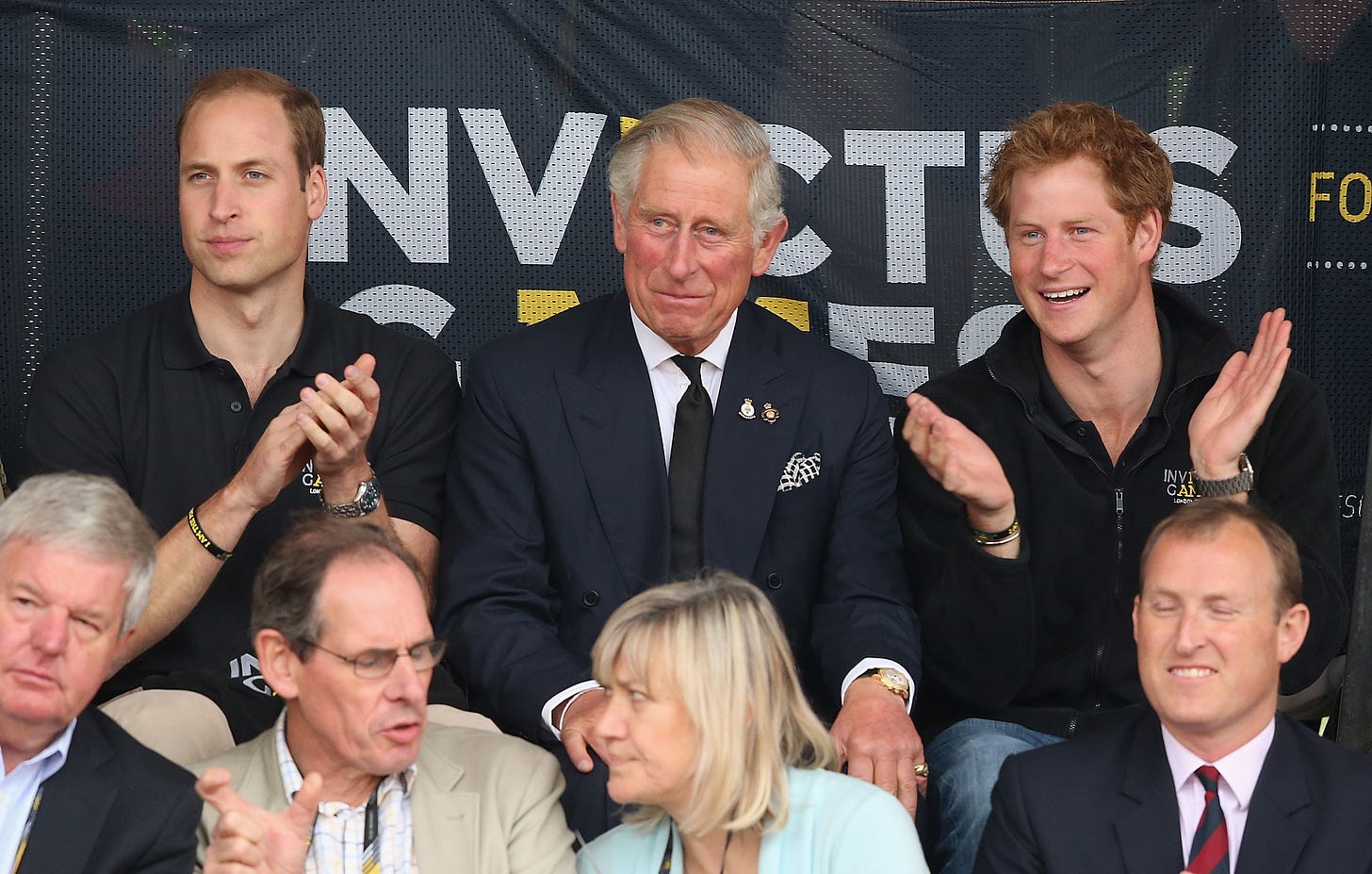 Prince William, King Charles and Prince Harry in the stands at the Invictus Games in 2014