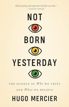 Cover of Not Born Yesterday by Hugo Mercier. Text with three eyes is red, yellow and green. Cover of Not Born Yesterday by Hugo Mercier. Text with three eyes is red, yellow and green.