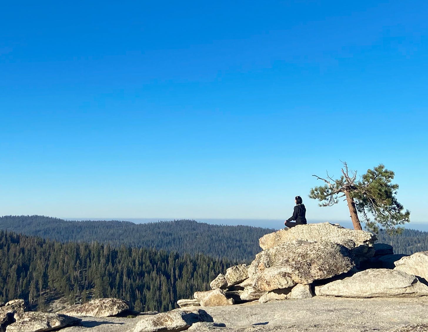 The author meditating on a rock at Sentinel Dome Trail
