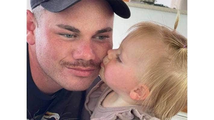 Andre Bradshaw died while out walking on the beach with his daughter, Skyla