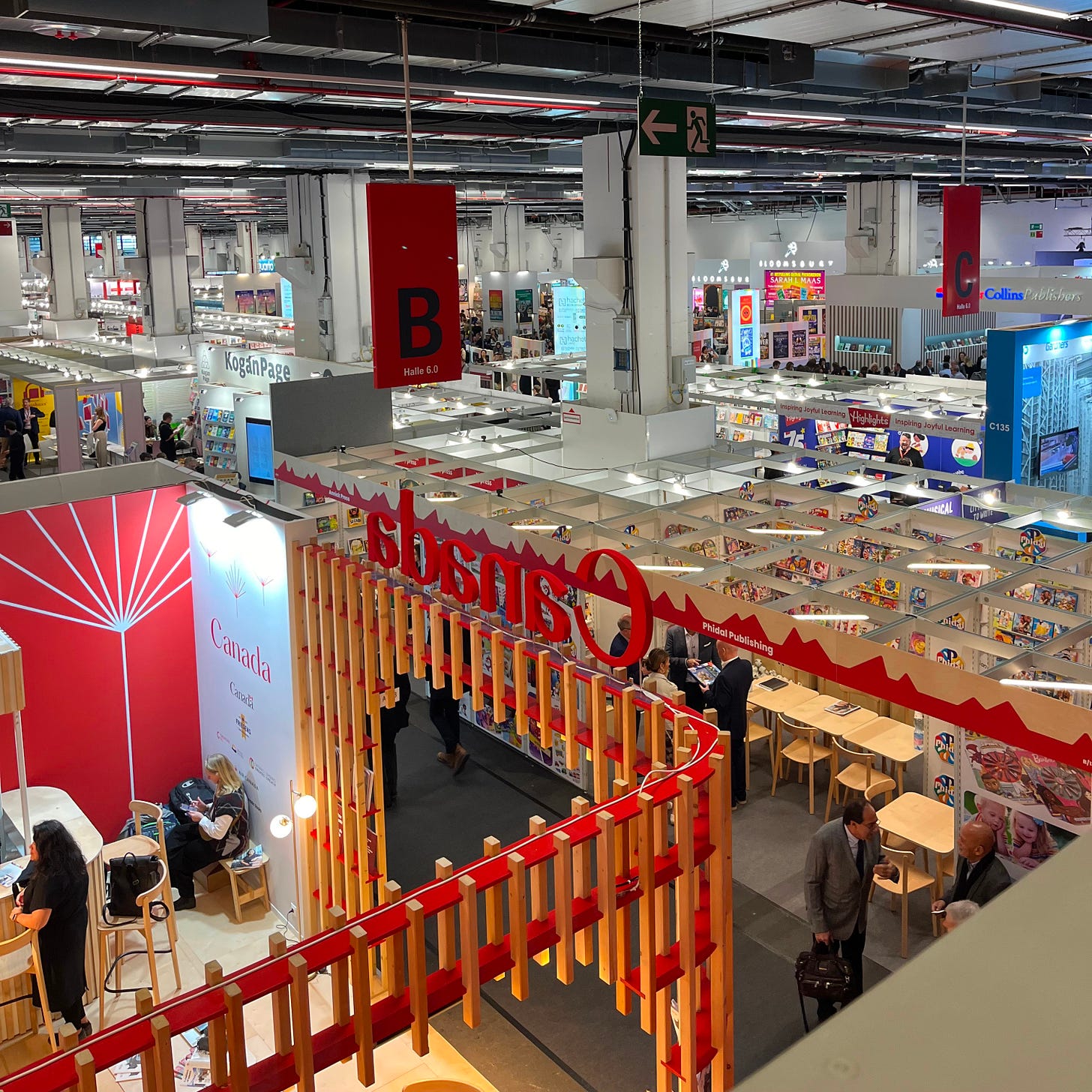 A photo of one of the Frankfurt Book Fair halls taken from above when you see a variety of stands and people