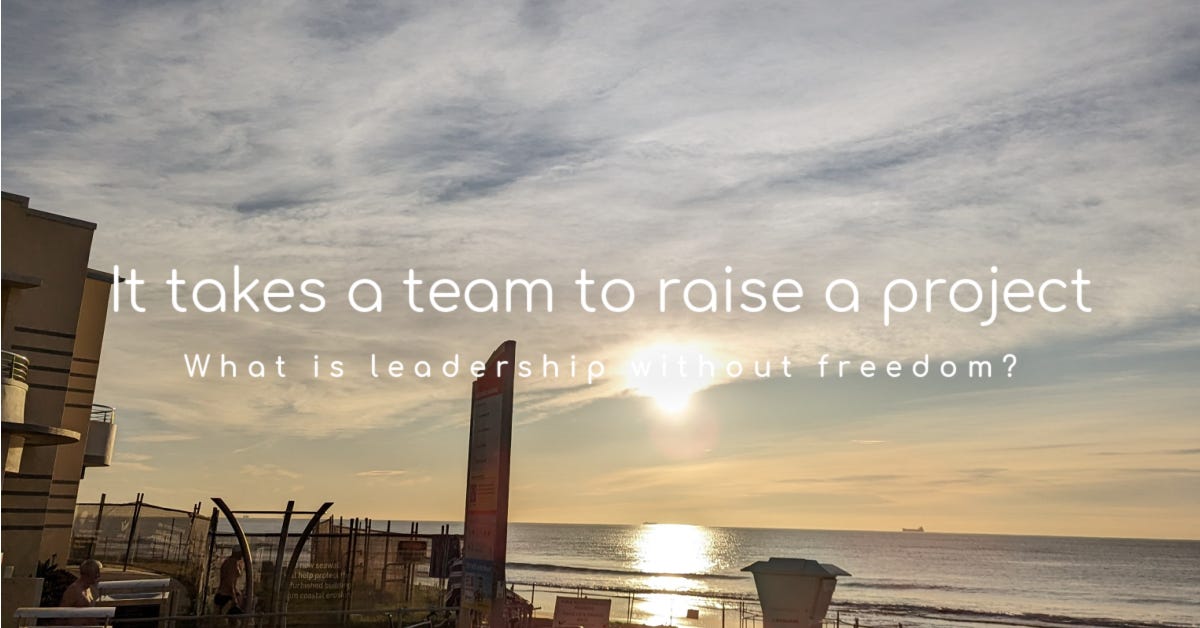 it takes a team to raise a project. What is leadership without freedom? positioned over a picture of North Wollongong beach and cafe