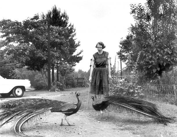 Black-and-white photo of a woman with short dark hair and glasses who uses crutches. Before her are peahens.