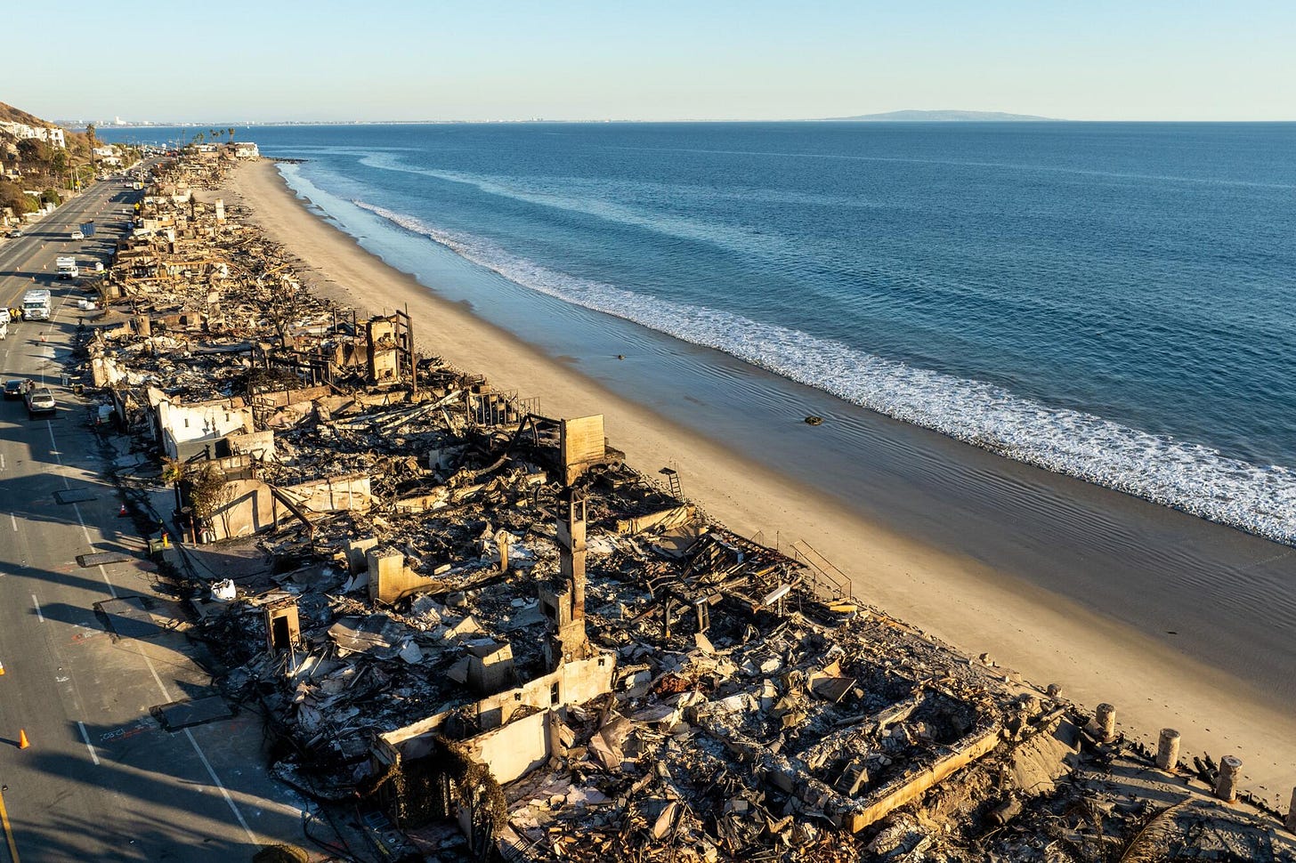 A drone image of the aftermath of the Palisades fire above Pacific Coast Highway in Malibu 