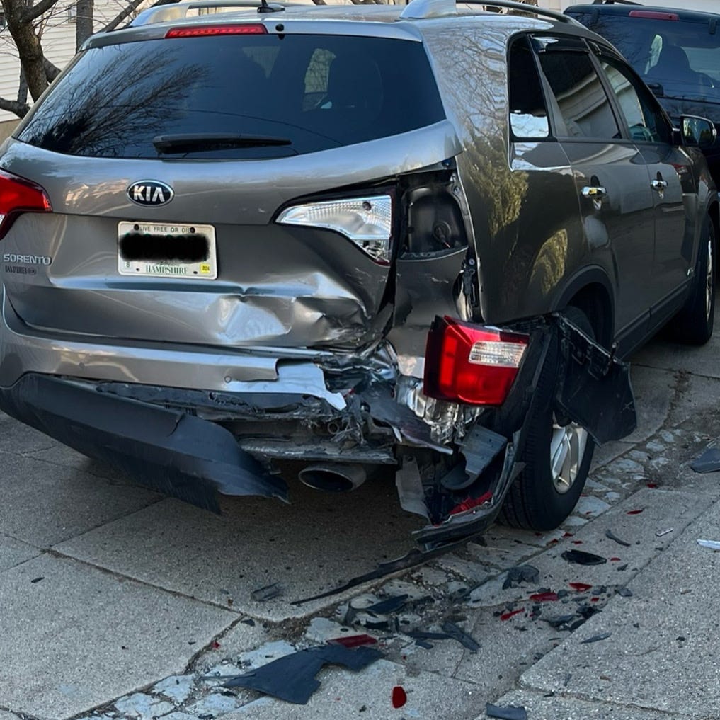 2015 Kia Sorento that has been rear-ended in the driveway