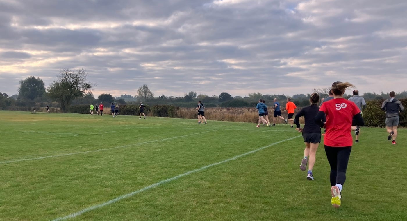 Runners going round the edge of playing fields