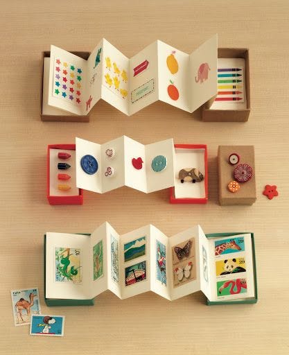 This may contain: an open book with pictures and magnets in it on top of a wooden table