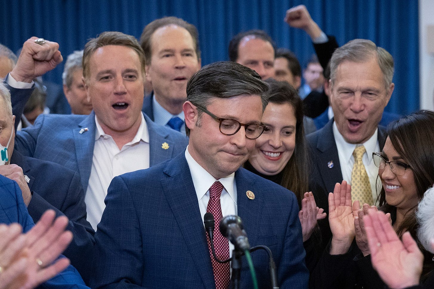 WASHINGTON, DC - OCTOBER 24: U.S. Rep. Mike Johnson (R-LA) surrounded by cheering House Republicans speaks after being elected as the speaker nominee during a GOP conference meeting in the Longworth House Office Building on Capitol Hill on October 24, 2023 in Washington, DC. The conference was meeting in a closed-door session to select a successor to ousted Speaker Kevin McCarthy (R-CA), who was removed on October 4 in a move led by a small group of conservative members of his own party.  (Photo by Win McNamee/Getty Images)