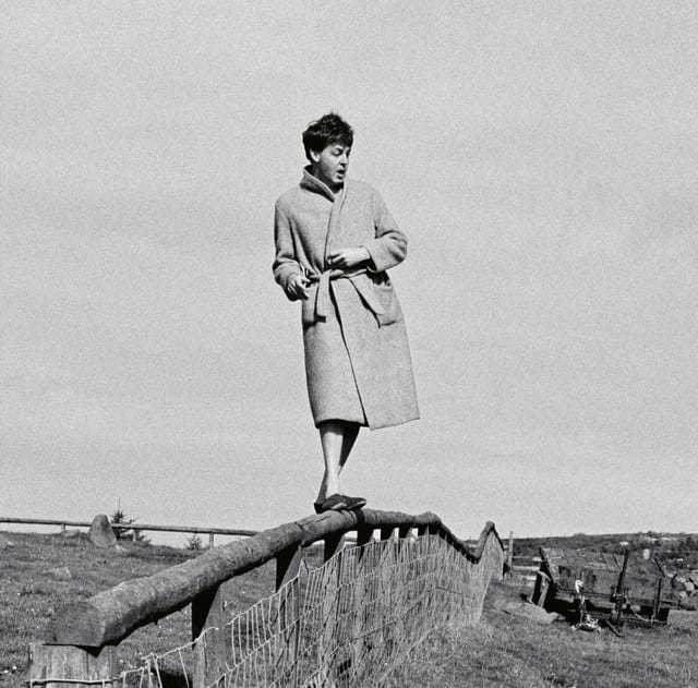 r/beatles - Paul standing on a fence in his slippers and dressing gown. Why? Who knows.