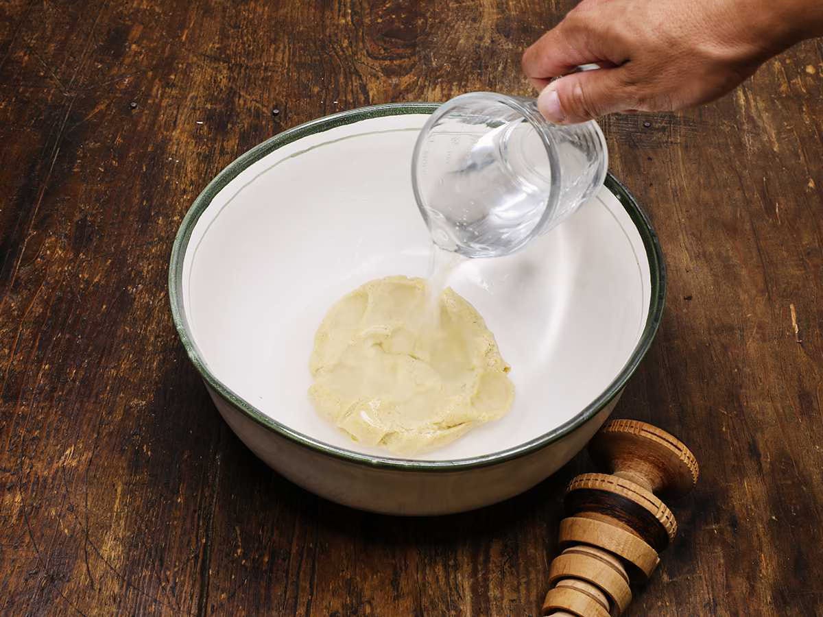 adding water to masa